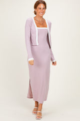 woman wearing a lavender ribbed maxi dress with a square neckline and a matching cropped cardigan