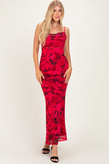 woman wearing a red floral maxi dress with spaghetti straps and a form-fitting style, standing on a white background