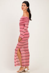 woman wearing a pink striped off-the-shoulder maxi dress with a thigh-high slit and long sleeves