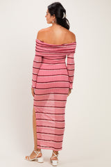 woman wearing a pink and black striped off-the-shoulder dress with a thigh-high slit, seen from the back
