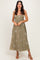 woman wearing a khaki floral strapless maxi dress with a flowy skirt and a fitted bodice