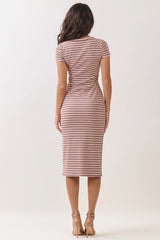 woman wearing a brown and white striped fitted midi dress with short sleeves, viewed from the back