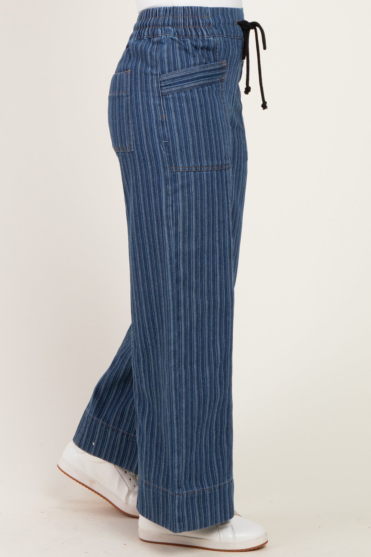 woman wearing blue striped wide-leg pants with an elastic waistband and drawstring detail