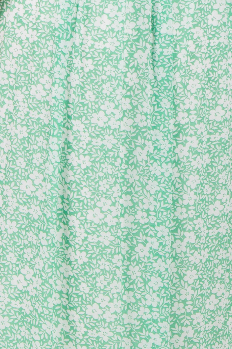 green floral print midi dress with a relaxed fit and subtle pleating details