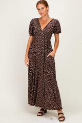 woman wearing a brown polka dot maxi dress with puff sleeves and pockets