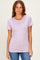 woman wearing a light lavender short sleeve t-shirt with a round neckline and styled with blue jeans