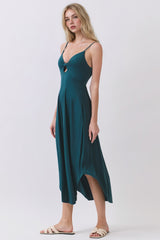 woman wearing a teal midi dress with a keyhole detail at the bust and spaghetti straps