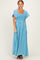 woman wearing a light blue maxi dress with a square neckline and flutter sleeves
