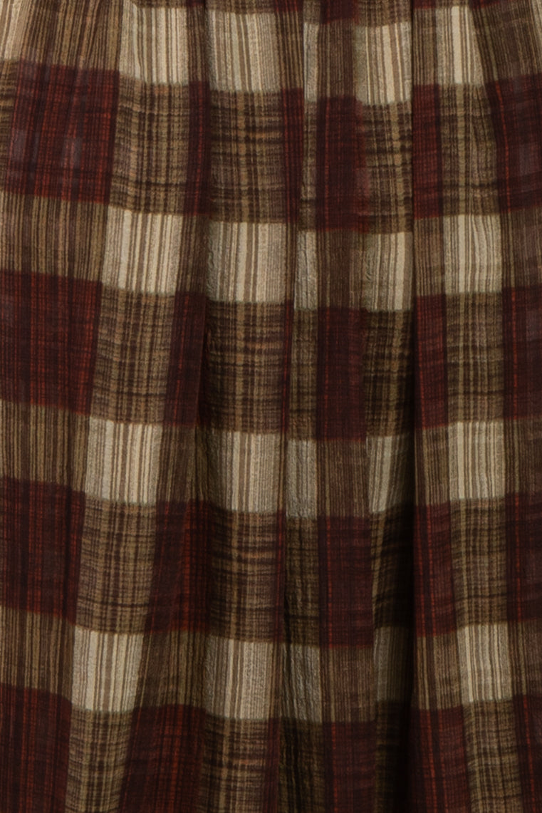 maternity wear in a plaid fabric featuring red, brown, and cream colors with a flowing style