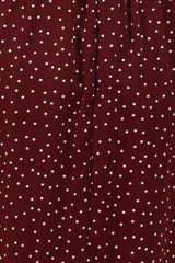 burgundy skirt with white polka dots and a gathered waistband detail