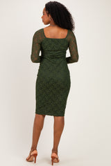 woman wearing a green lace midi dress with three-quarter sleeves and a fitted silhouette, viewed from the back
