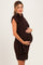 woman wearing a chocolate brown sleeveless maternity sweater dress and holding her baby bump