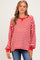 woman wearing a red and white striped maternity sweater with a relaxed fit and wide neckline, showing her baby bump