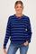 woman wearing a navy blue striped maternity sweater with long sleeves and a relaxed fit