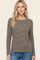 woman wearing a brown and cream striped long sleeve top with a round neckline and relaxed fit