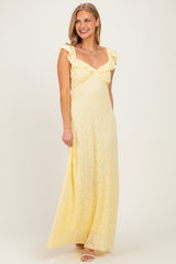 woman wearing a yellow lace maxi dress with ruffle sleeves and a sweetheart neckline