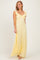 woman wearing a yellow lace maxi dress with ruffle sleeves and a sweetheart neckline