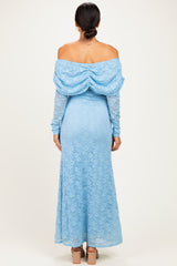 woman wearing a back view of a light blue off-the-shoulder lace maxi dress