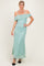 woman wearing a mint green off-the-shoulder lace maxi dress with fitted silhouette and spaghetti straps