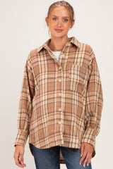 woman wearing a brown plaid maternity button-up shirt with a relaxed fit and side pocket