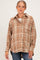woman wearing a brown plaid maternity button-up shirt with a relaxed fit and side pocket