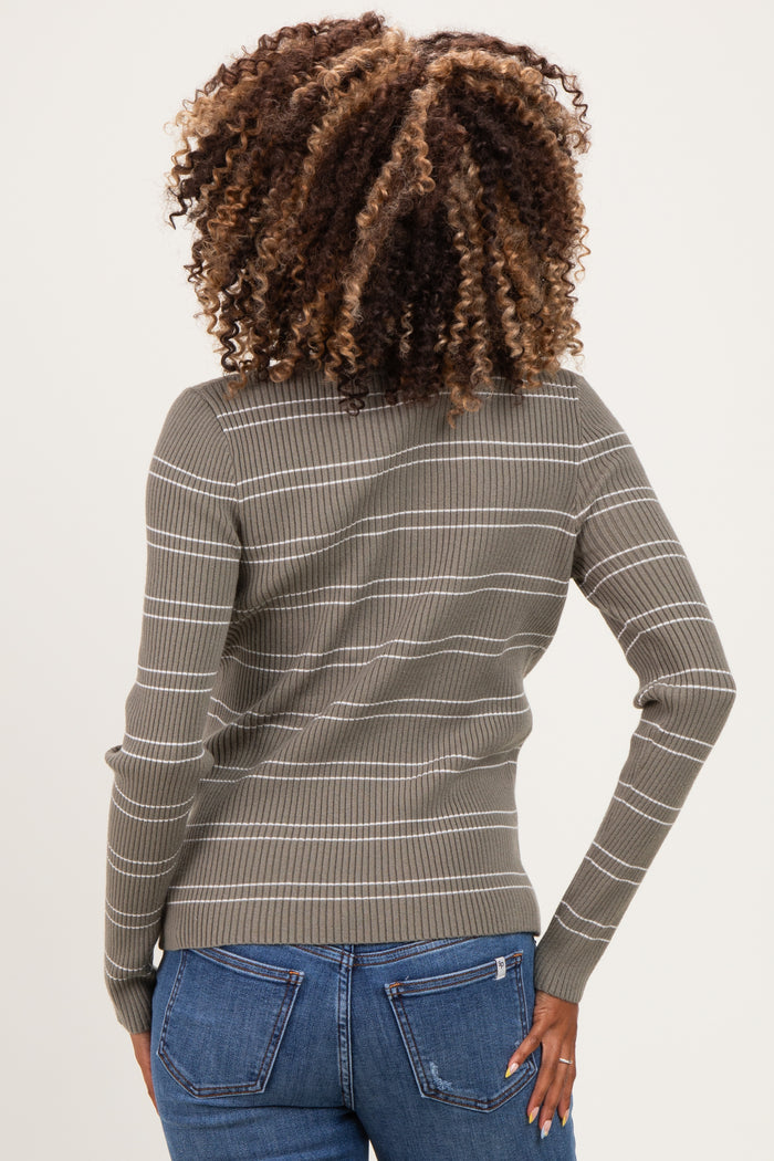 woman wearing an olive green striped maternity sweater, viewed from the back with a fitted style and long sleeves