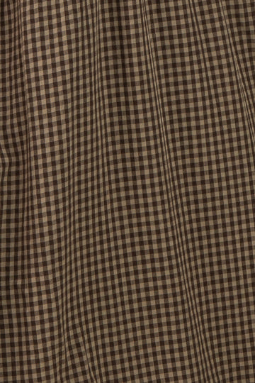 brown and beige gingham plaid fabric with a textured surface