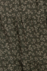dark green floral tiered dress with subtle patterns and ruffled layers