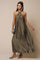 woman wearing an olive green halter neck maxi dress with a flowing silhouette and silver earrings