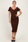 woman wearing a brown puff sleeve ruched midi dress with a sweetheart neckline and a bodycon fit