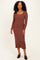 woman wearing a brown long sleeve ribbed midi dress and black mules