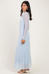 woman wearing a light blue long sleeve lace maxi dress with a flowy fit and side cutouts