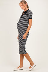 woman wearing a black and white striped maternity dress with a polo collar and a visible baby bump
