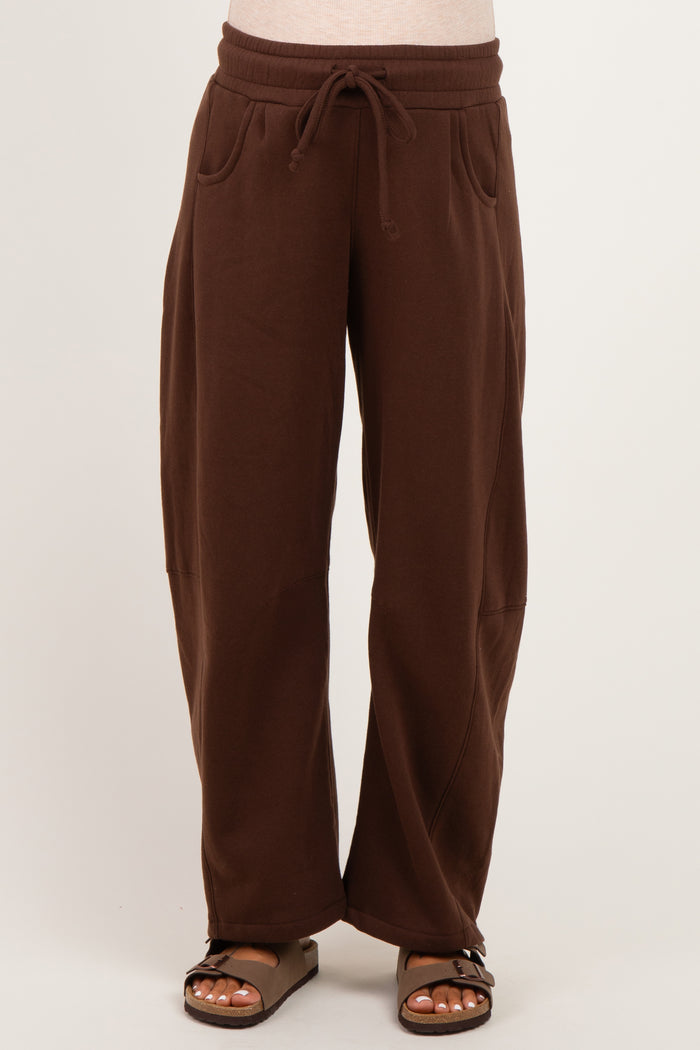 woman wearing brown maternity wide-leg sweatpants with drawstring waist and side pockets