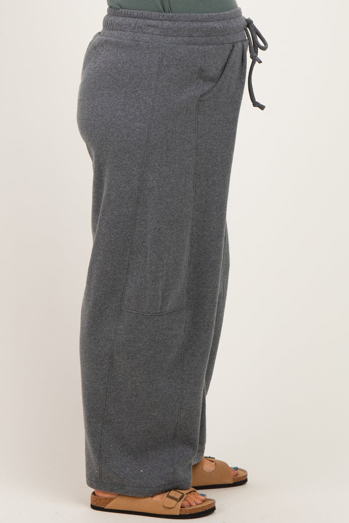 woman wearing gray maternity sweatpants with side pockets and an elastic waistband
