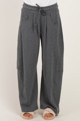 woman wearing gray wide-leg sweatpants with an elastic waistband and side pockets