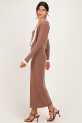 woman wearing a brown ribbed long sleeve dress with a white collar and long cardigan, paired with brown heeled sandals