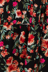 floral print black dress featuring vibrant red and pink flowers with a tiered design