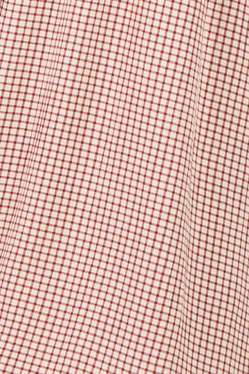 red and cream checkered fabric texture with a grid pattern