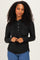 woman wearing a black long sleeve hoodie with buttons and a drawstring, styled with blue jeans