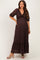 woman wearing a dark brown lace maternity maxi dress with a plunging neckline and short puff sleeves, showing her baby bump