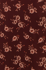 burgundy floral fabric with peach flowers and green leaves throughout