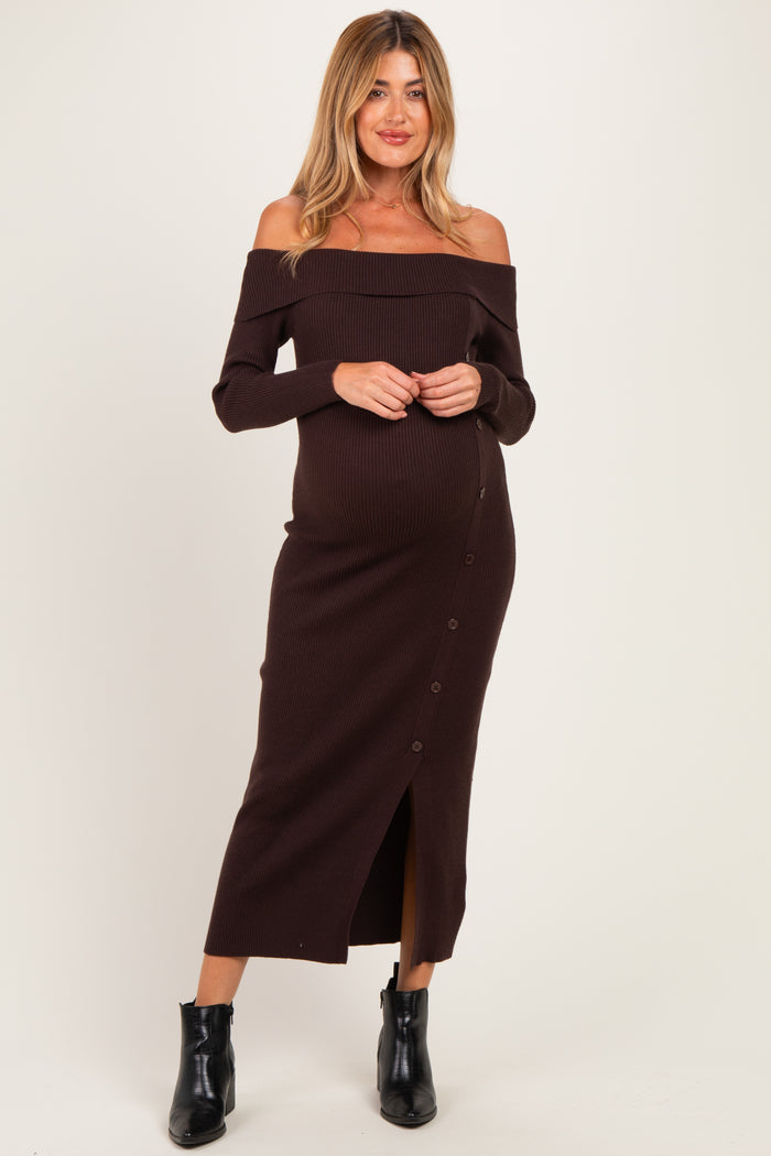 woman wearing a brown off-shoulder ribbed maternity dress with button details and a visible baby bump