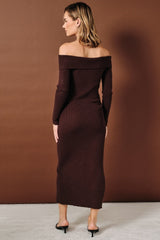 woman wearing a brown off-the-shoulder ribbed maxi dress with long sleeves and a fitted silhouette
