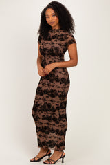 woman wearing a brown floral lace maxi dress with cap sleeves and a fitted silhouette