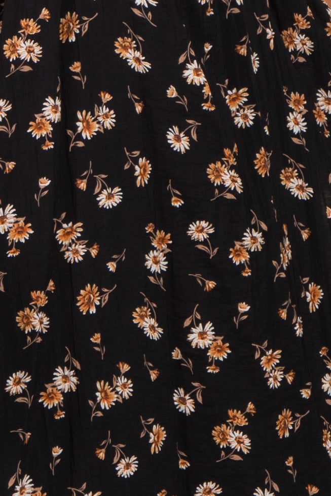 black floral midi skirt with orange and white daisy patterns