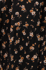 black maternity dress with white and orange floral print and pleated detailing