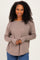 woman wearing a taupe long sleeve top with a relaxed fit and braided detail on the shoulders
