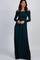 woman wearing a dark teal off-the-shoulder long sleeve maxi dress