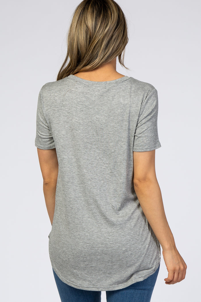 woman wearing a light grey ribbed short sleeve top with a rounded hem and back view showing relaxed fit